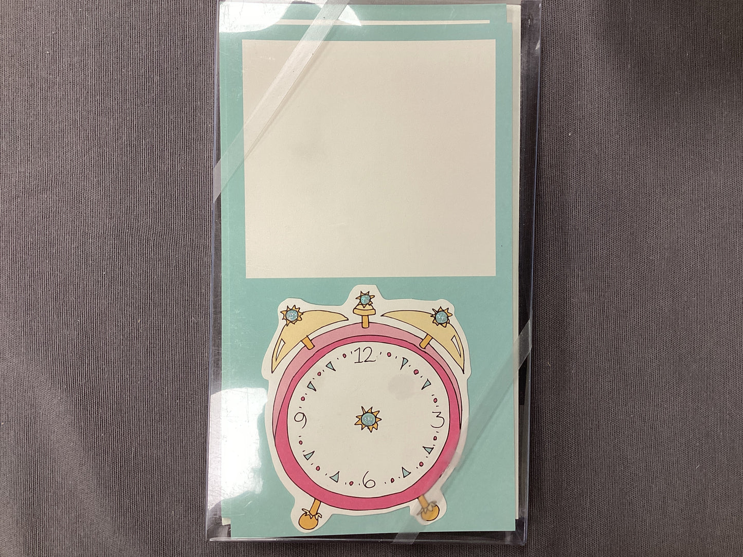 glittered clock on turquoise